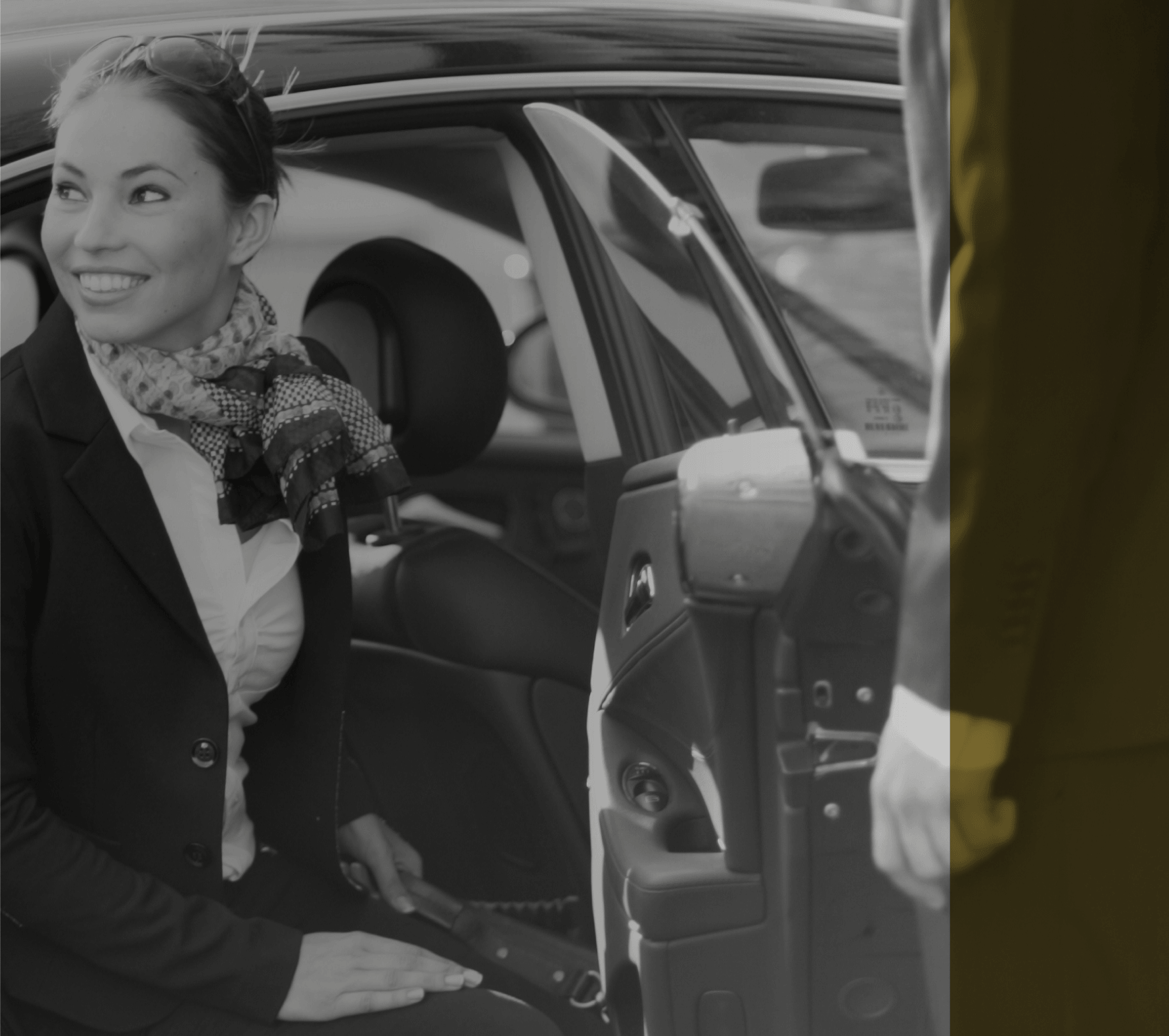 Professional chauffeur opening car door for Philadelphia executive transportation